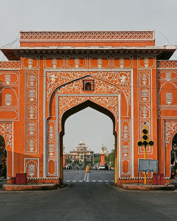 Ornate painted gateway in a Jaipur palace courtyard
